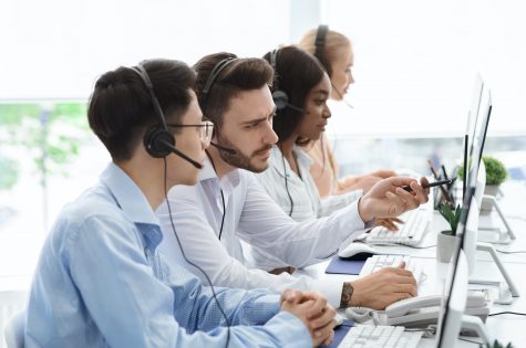 Technical support operators solving problem with client communication in call centre